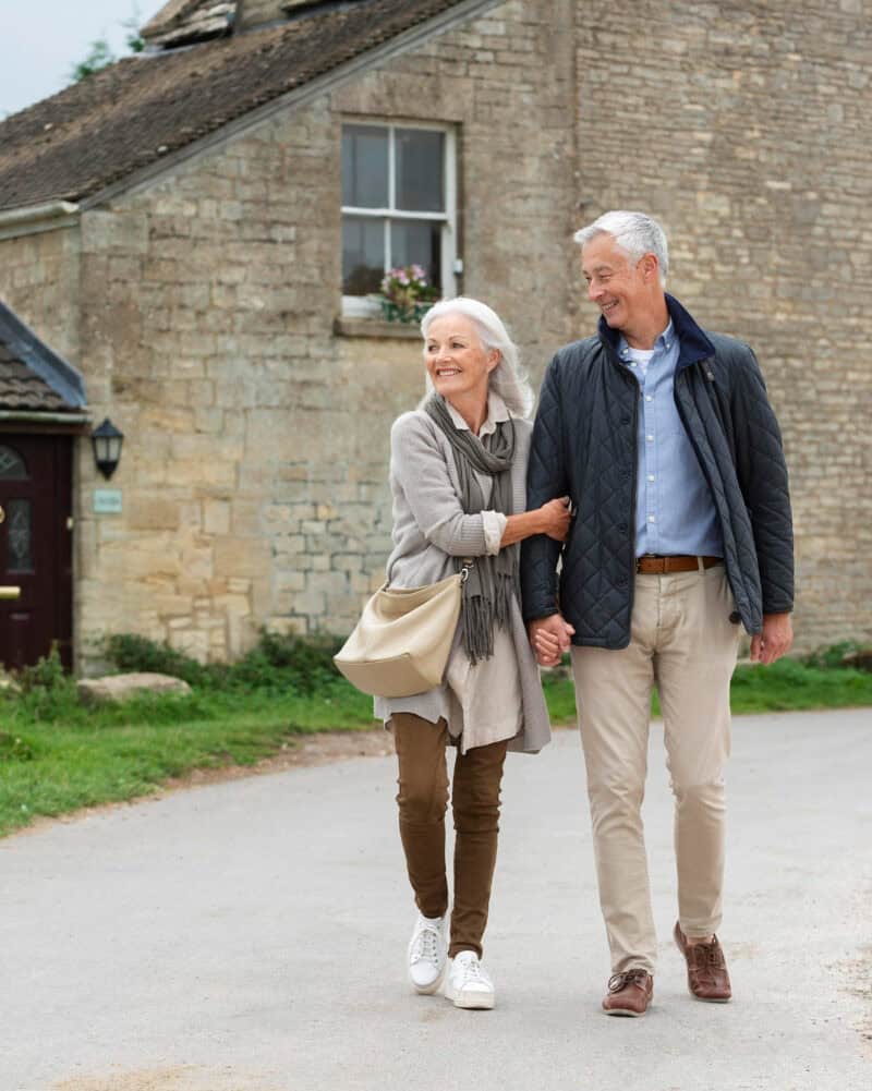 retired couple walking scenic small town USA