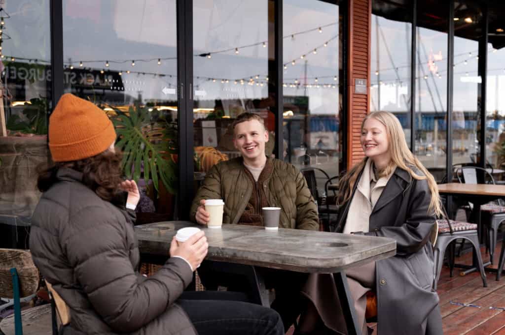 local café winter interior warm lighting rain on window travel atmosphere