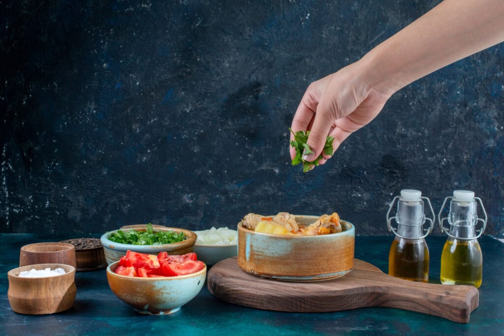 Hands preparing or serving dishes with cultural significance