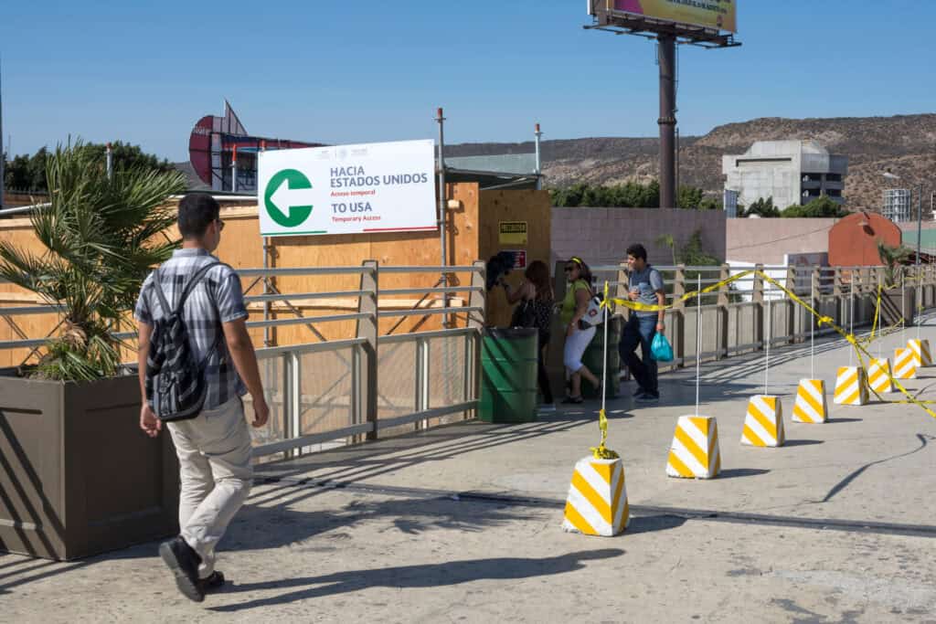 travelers at U.S.-Mexico border crossing,