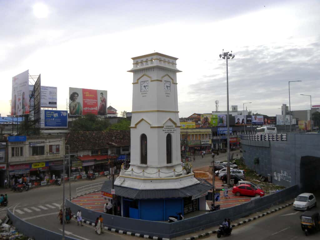 “city landmark clock tower intersection”