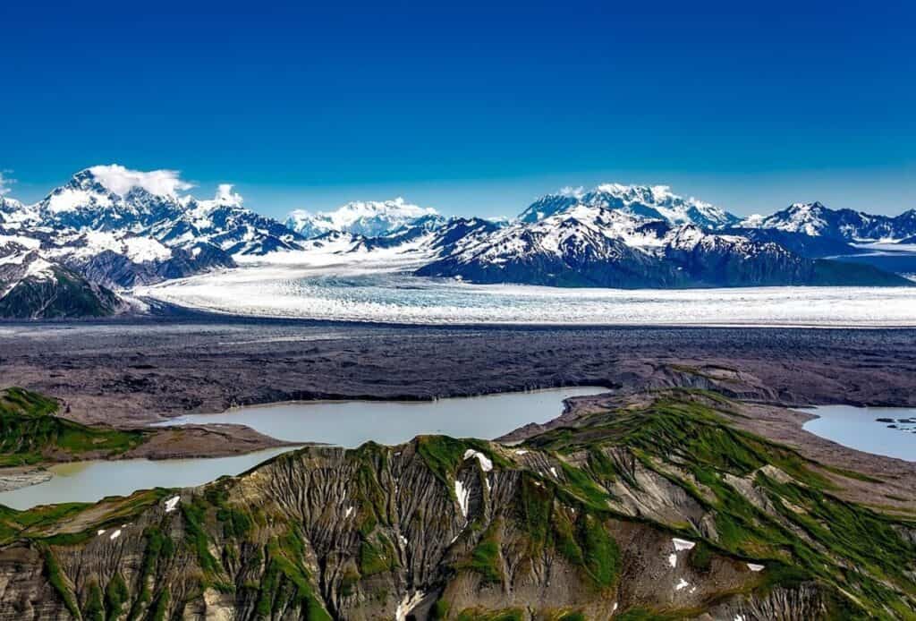 mountain peaks under blue sky