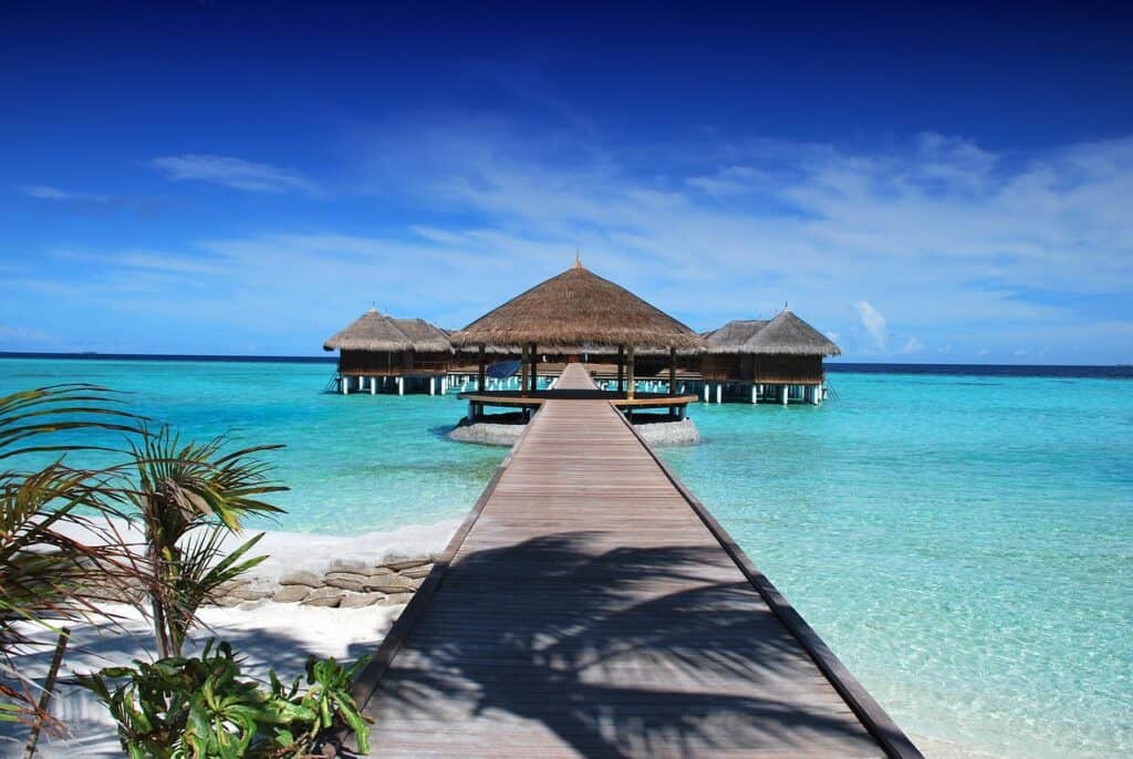 tropical island beach empty shoreline turquoise water aerial