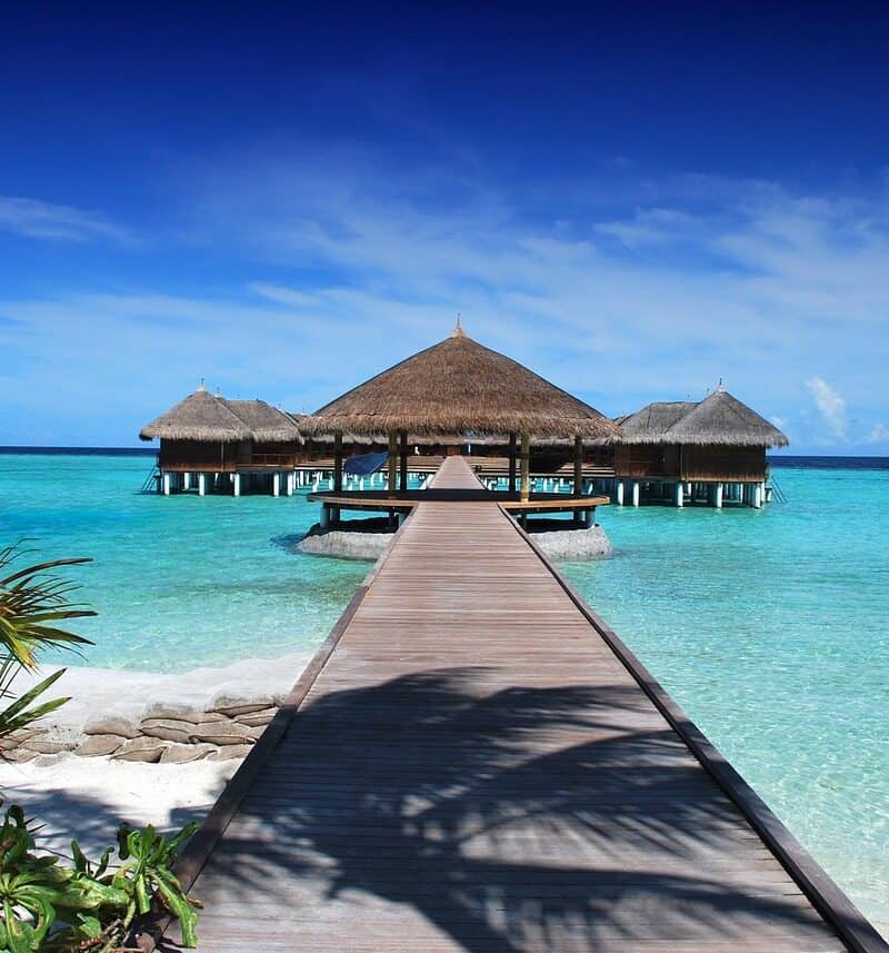 tropical island beach empty shoreline turquoise water aerial