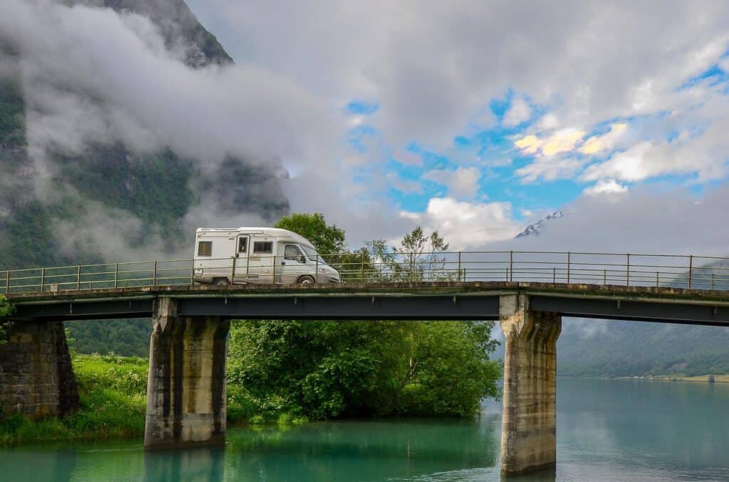 Storm clouds forming on an open road with RV.