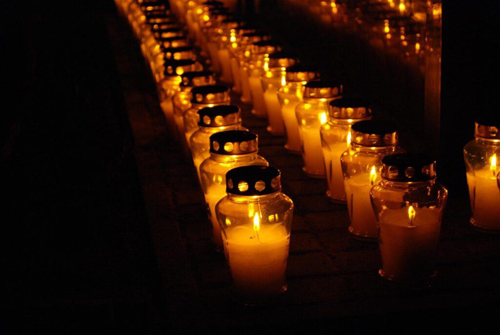 “All Saints Day Poland cemetery candles night vigil”