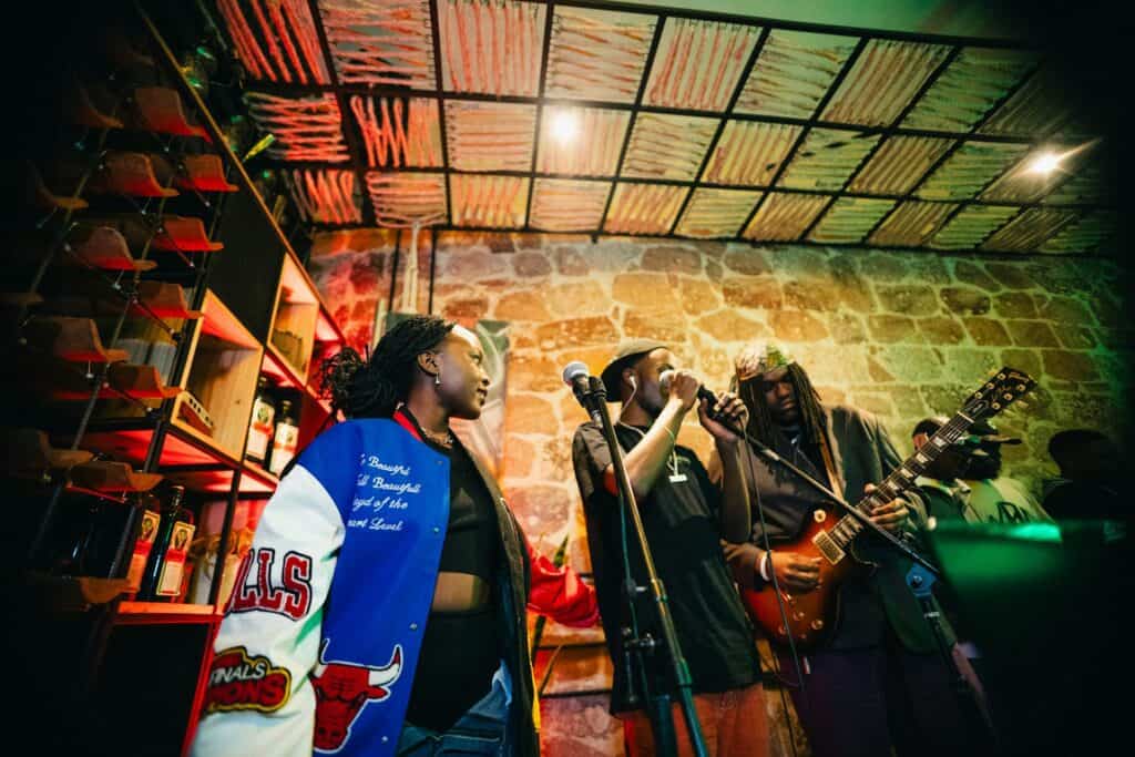 Black jazz musicians performing in intimate club