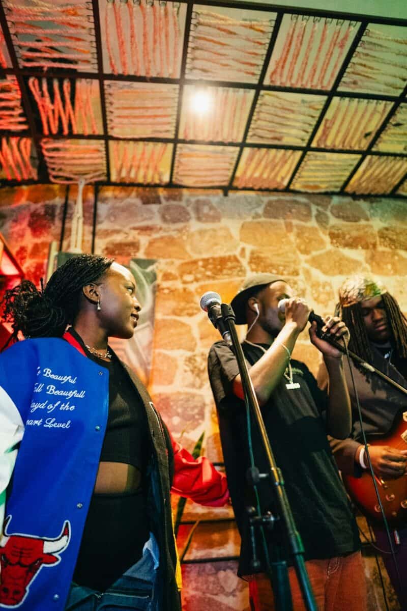 Black jazz musicians performing in intimate club