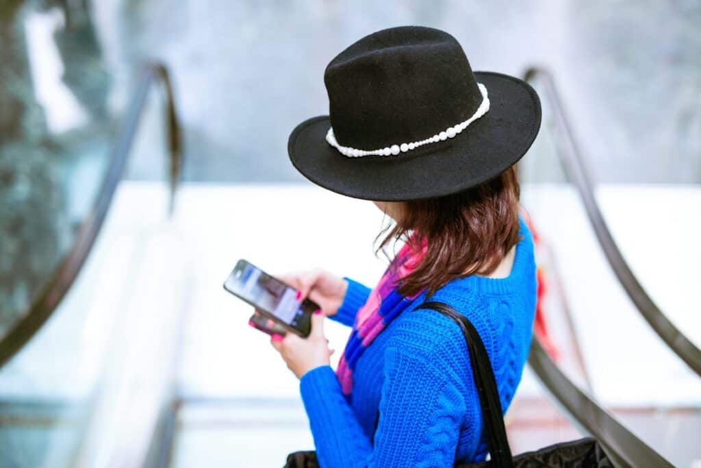 Traveler checking phone for discounts or booking