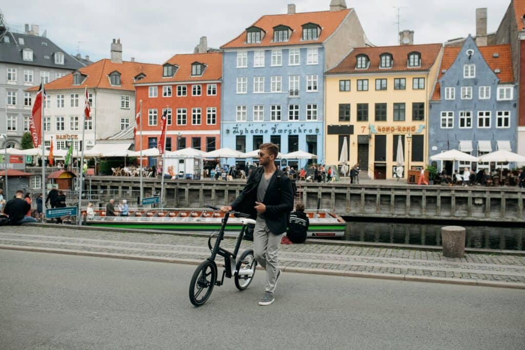travelers on e-bikes exploring a European city