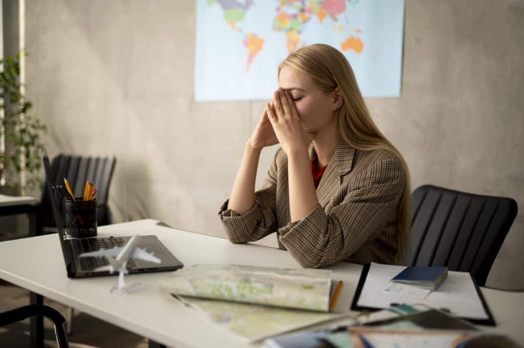 visa application stress concept at desk with paperwork,”