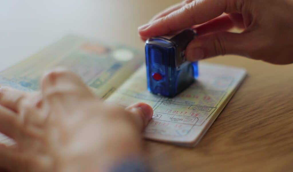 obtaining a stamp in the passport on entry into the territory of another state. Visa stamp in passport ID. Entry in foreign country.