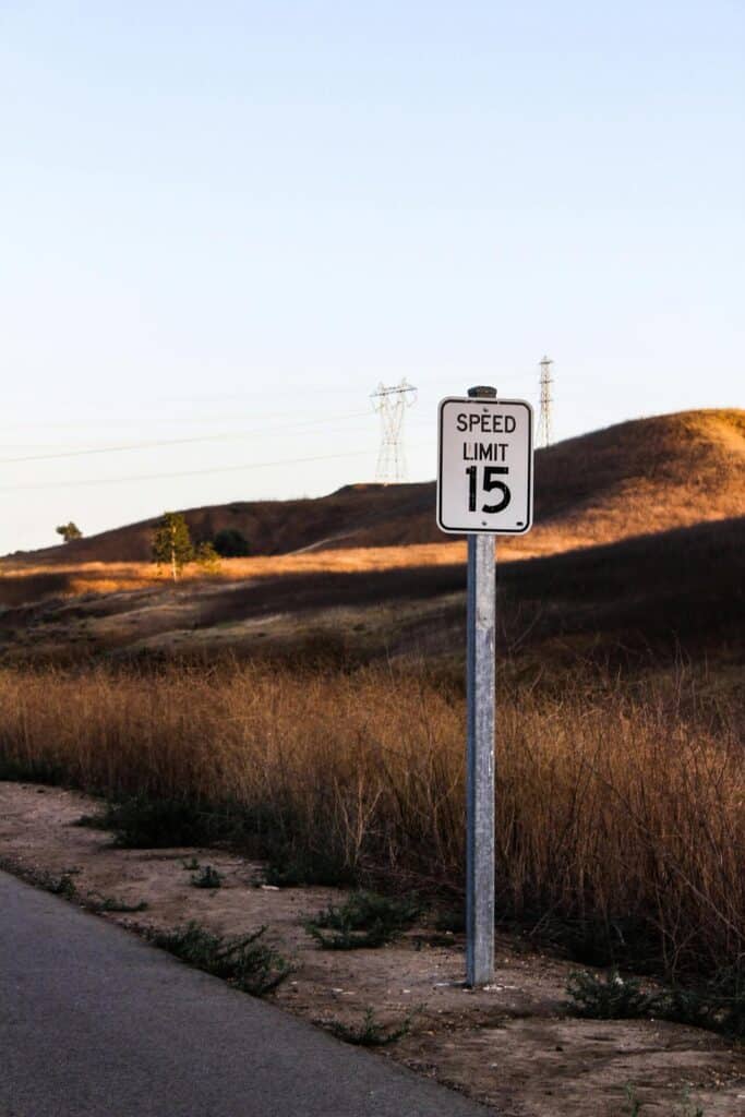 A highway sign showing towing speed limits.