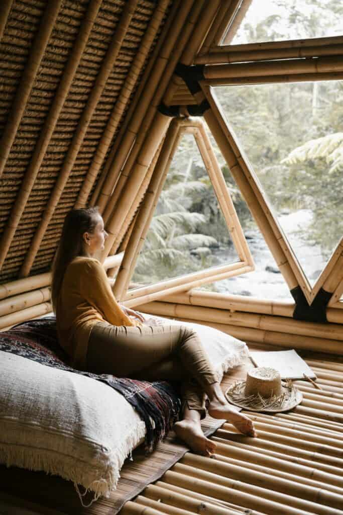 A person sitting by a window in a small inn,