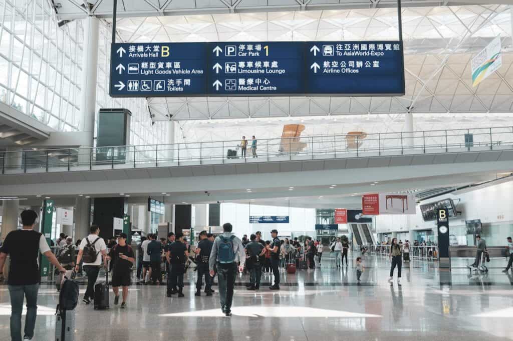 passengers walking calmly through a bright metro concourse