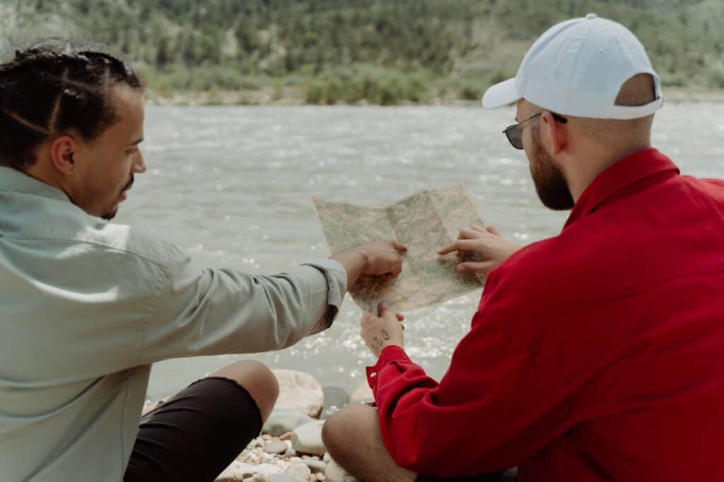 Traveler using a translation app or pointing politely on a map.