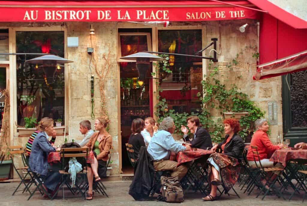A quiet café or restaurant tucked on a side street with a few locals dining.