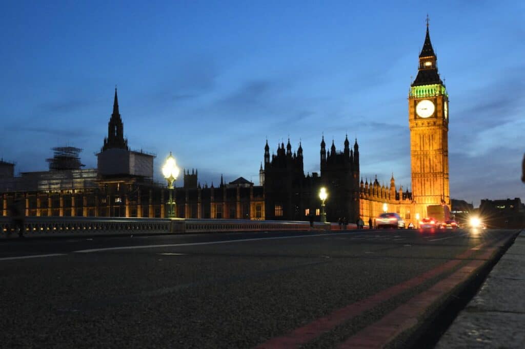 "traveler navigating city using landmarks clock tower night"