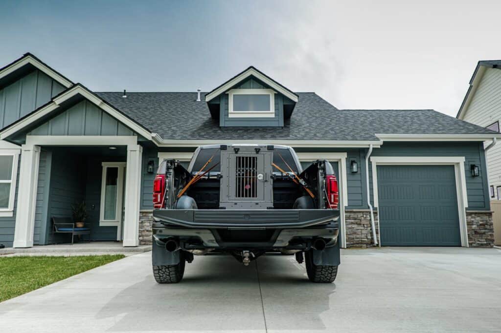 Pet crate strapped safely in a car