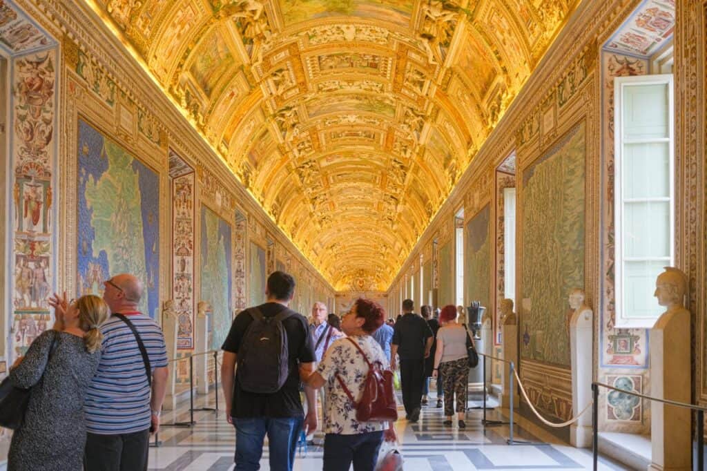 “Visitors admiring Raphael frescoes Vatican”