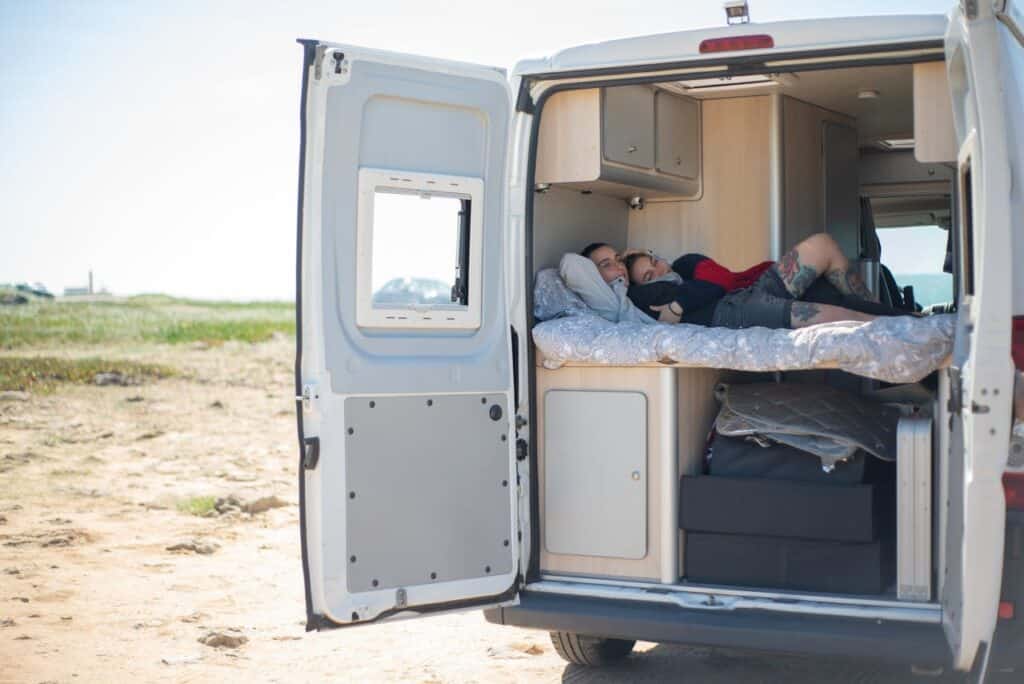 Packed RV interior showing heavy gear stored over the axle