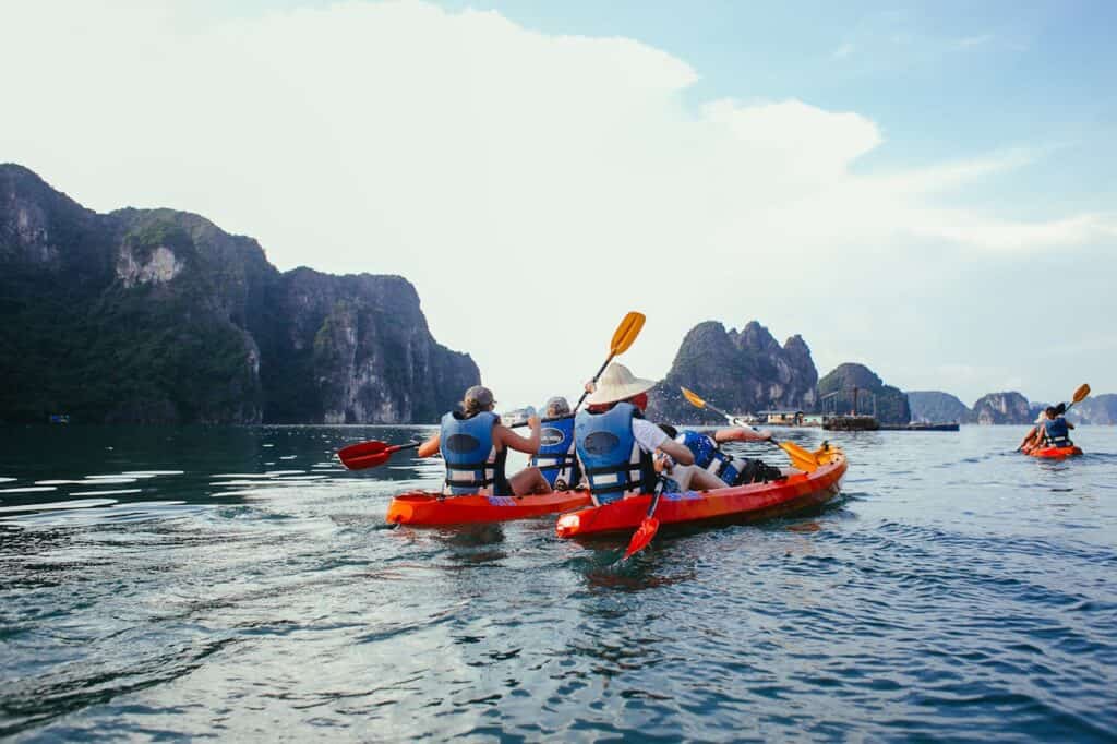 group transitioning from kayak to trail;