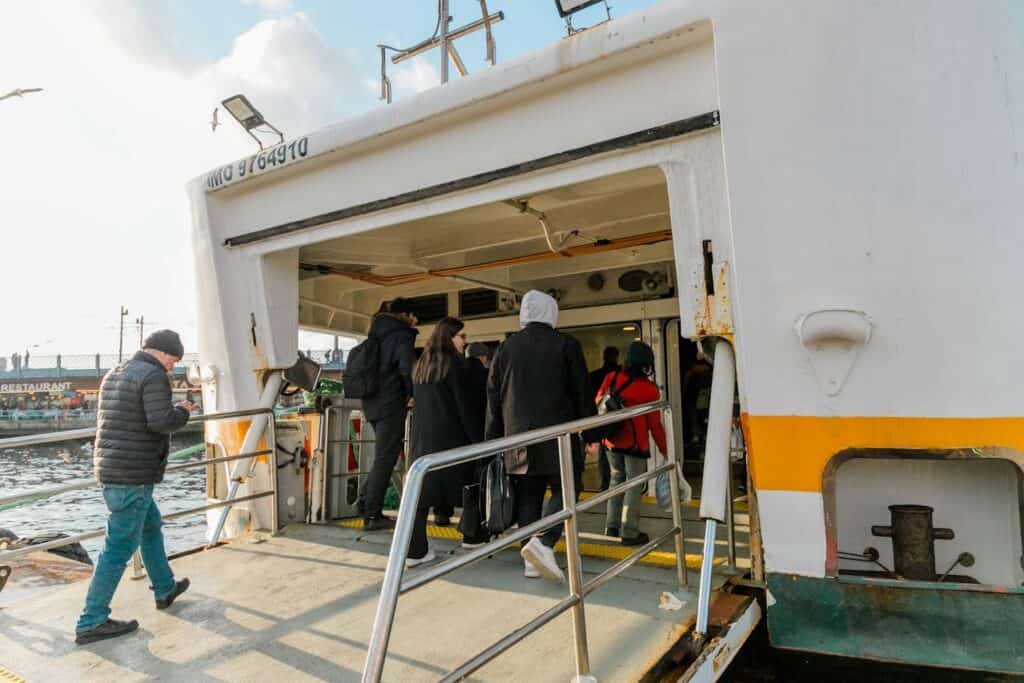 People Boarding a Ship