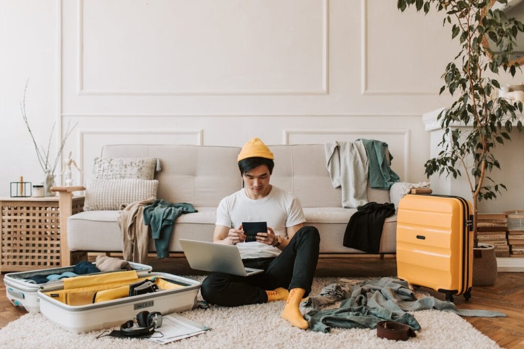 Traveler reading a vague listing description on a laptop or phone, looking unsure.