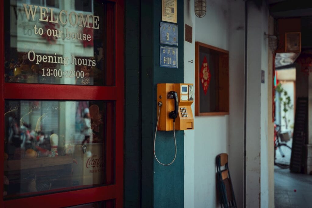 retro payphone street night scene travel