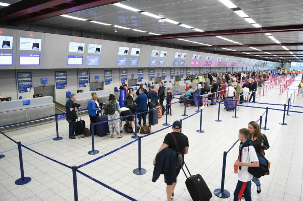 happy person flight booking at airport counter