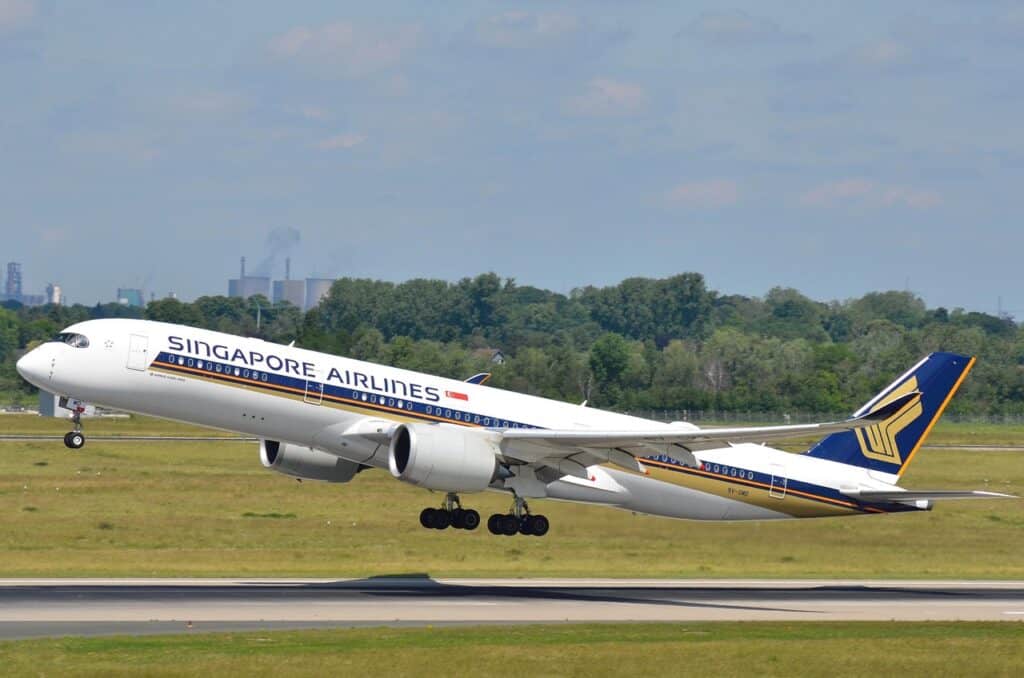 A plane taking off against a clear sky
