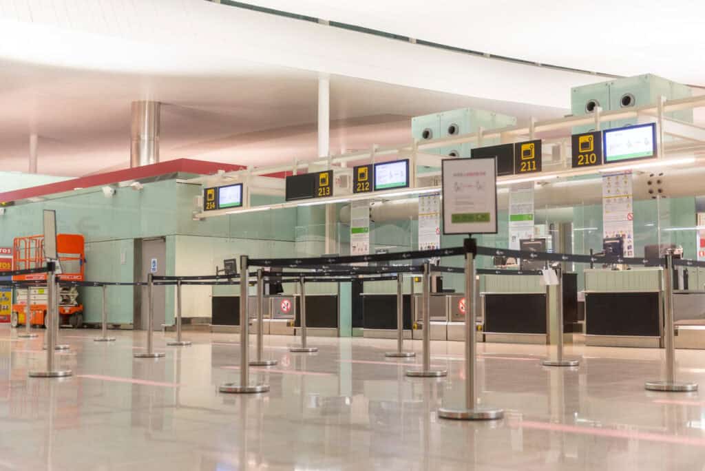A premium check-in counter with fewer passengers waiting