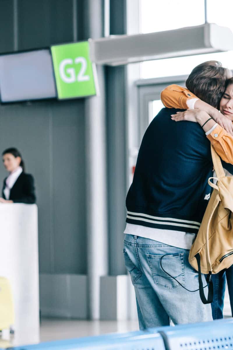 airport boarding gate family goodbye scene