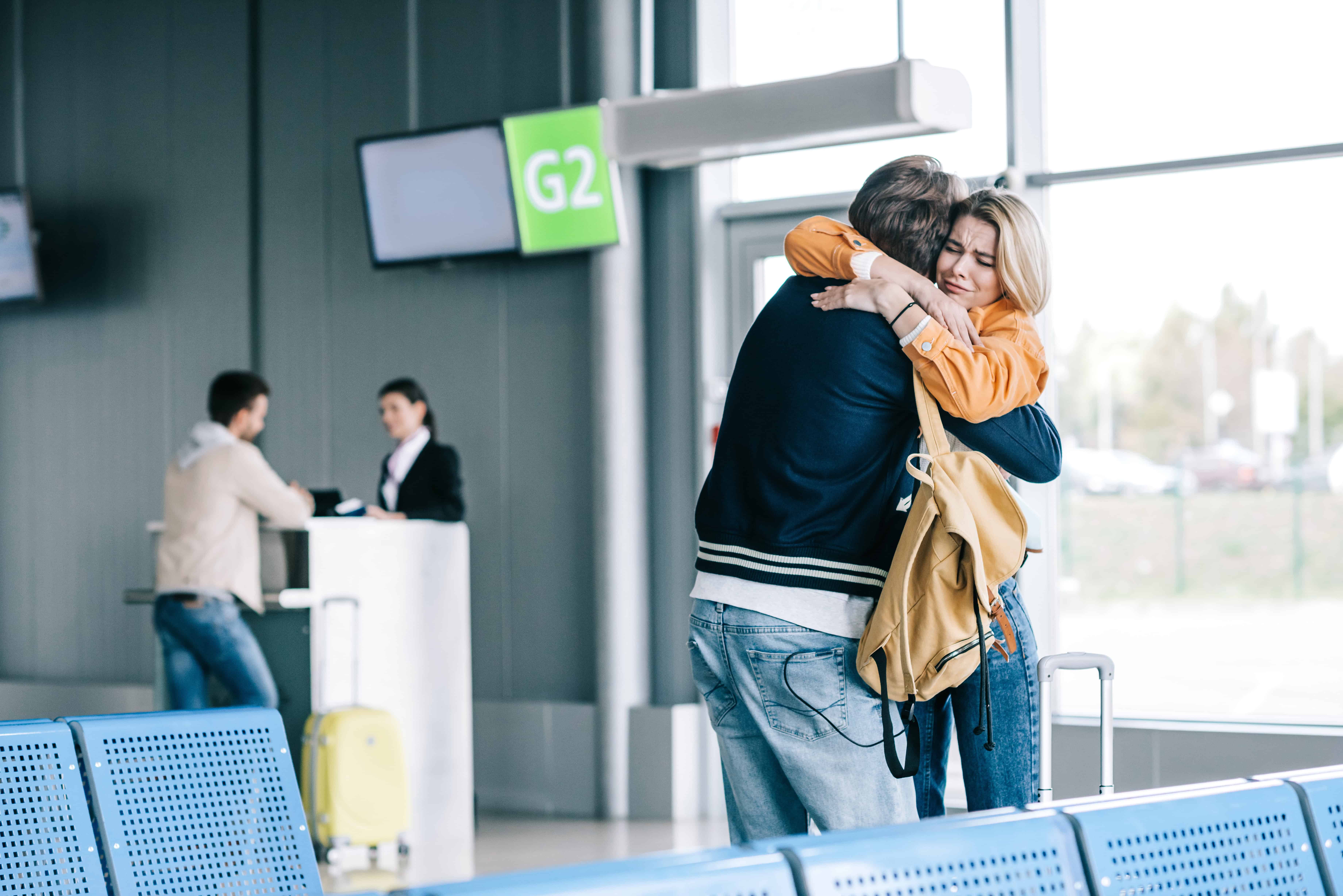 airport boarding gate family goodbye scene