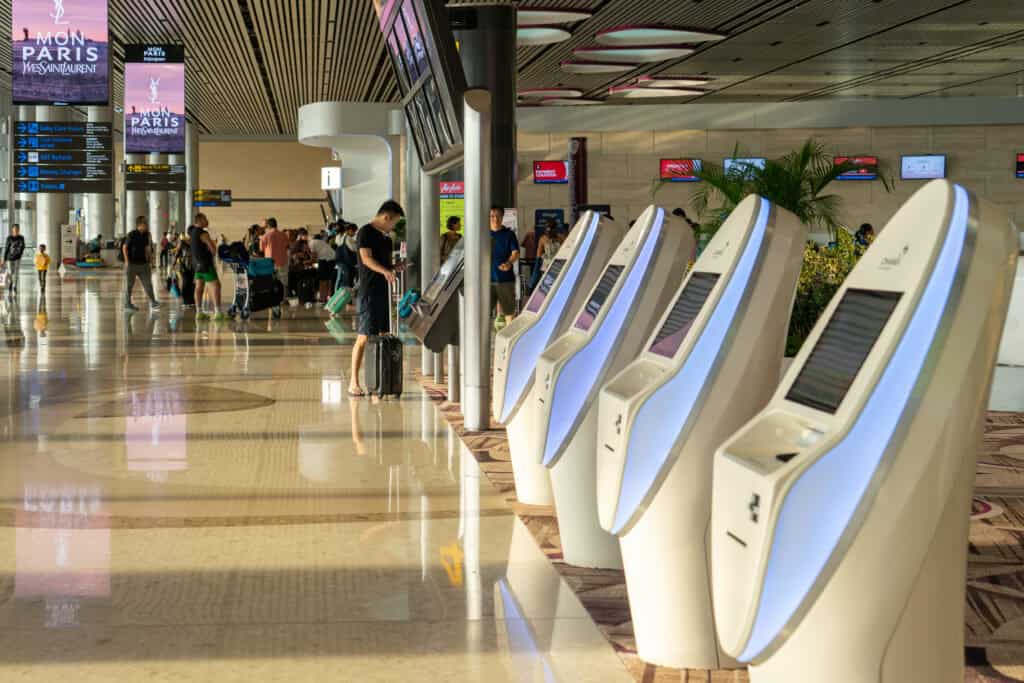 Visitors walk around Departure Hall in Changi Airport