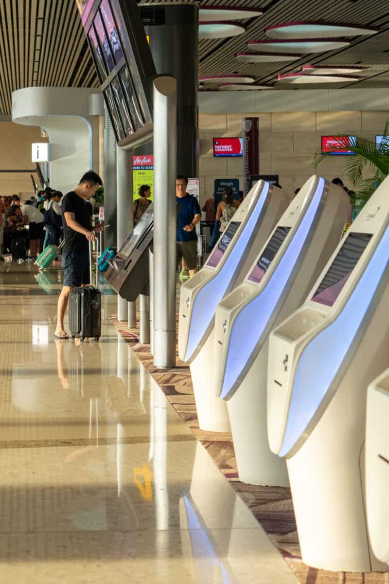 Visitors walk around Departure Hall in Changi Airport