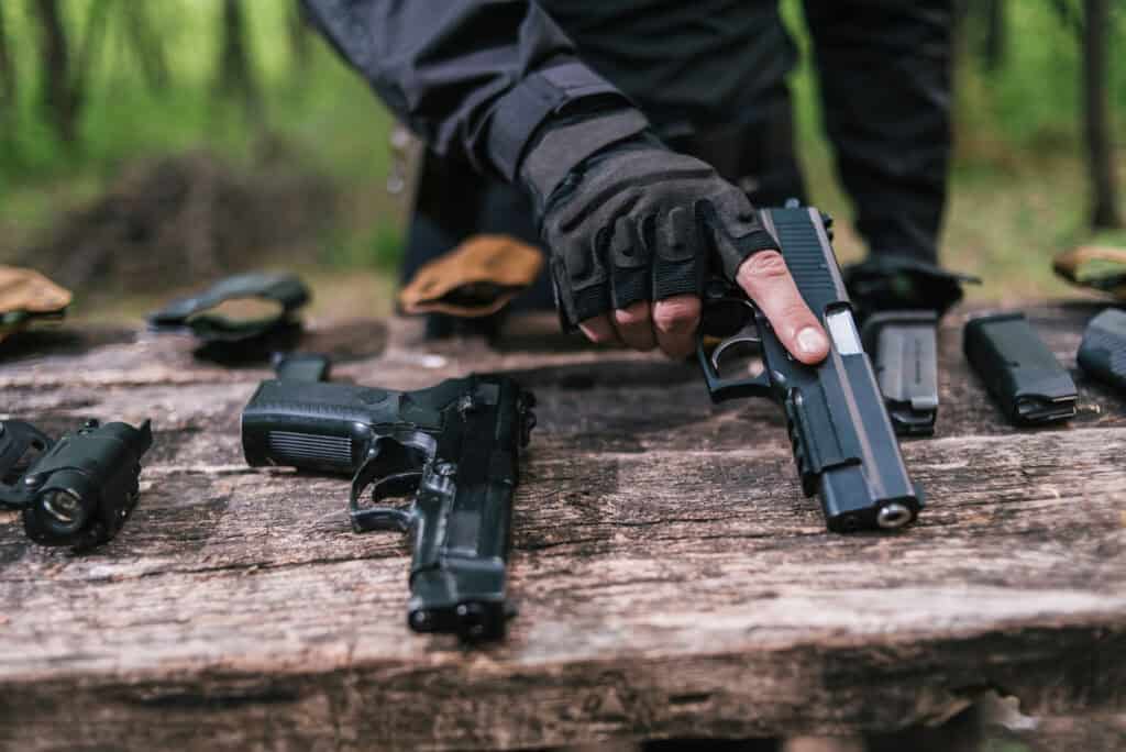 sports shooting instructor check your weapons close-up