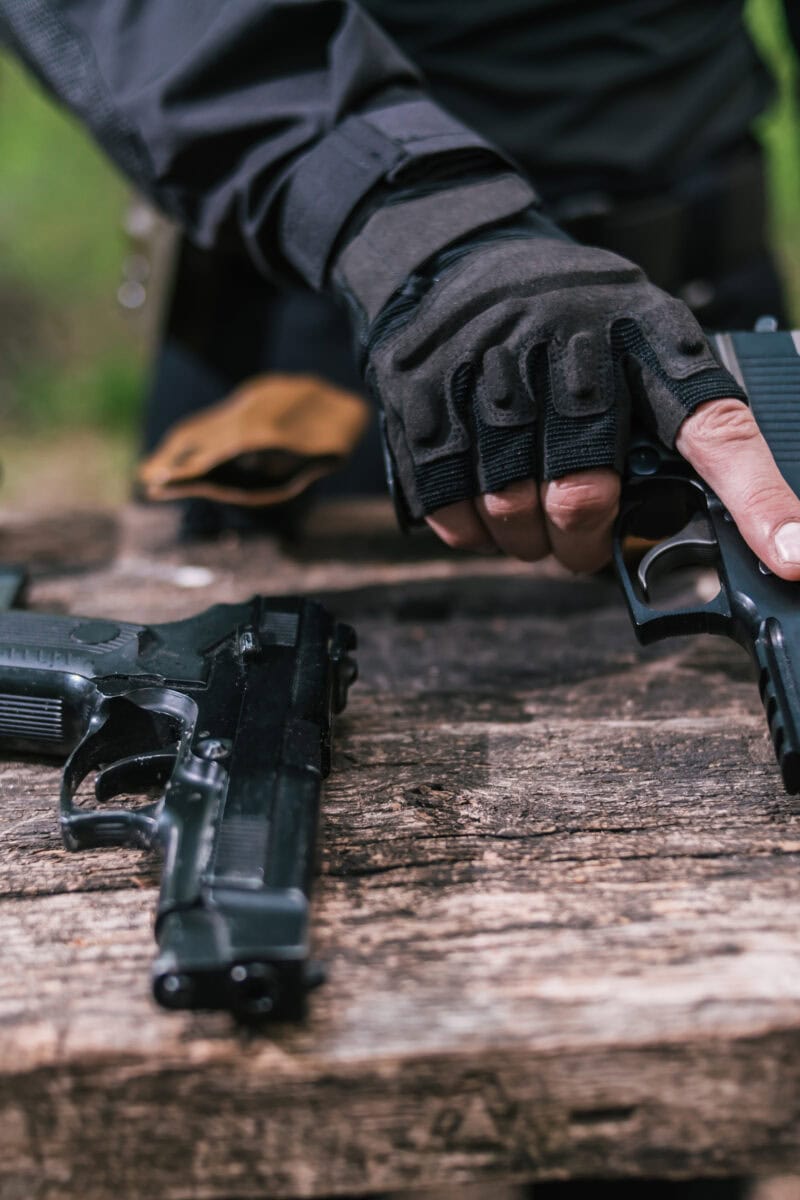 sports shooting instructor check your weapons close-up