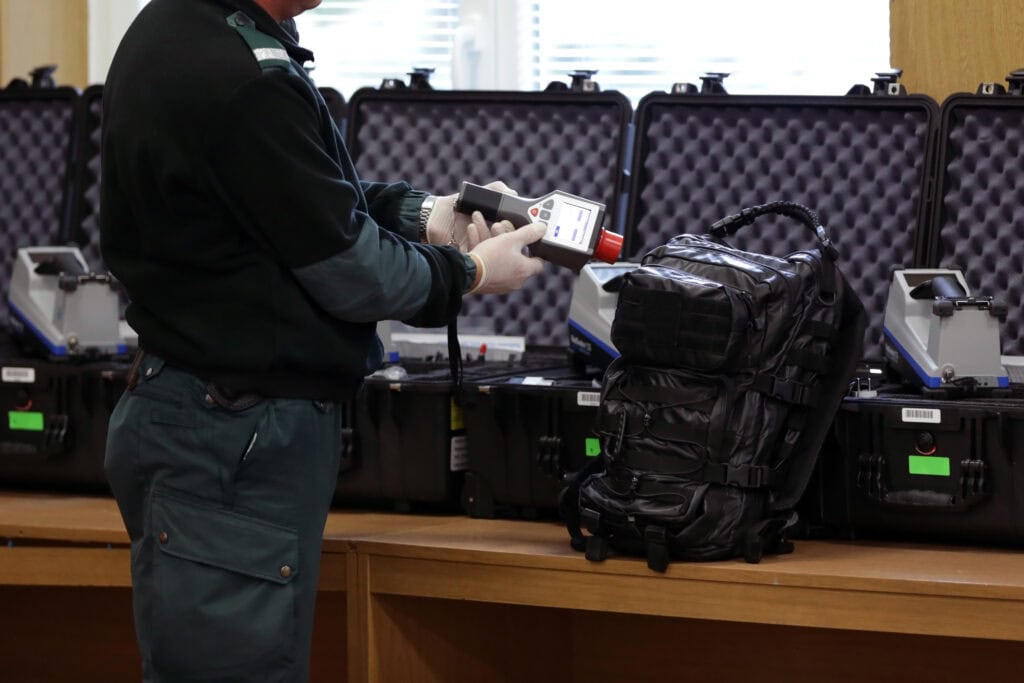 security officer luggage check”