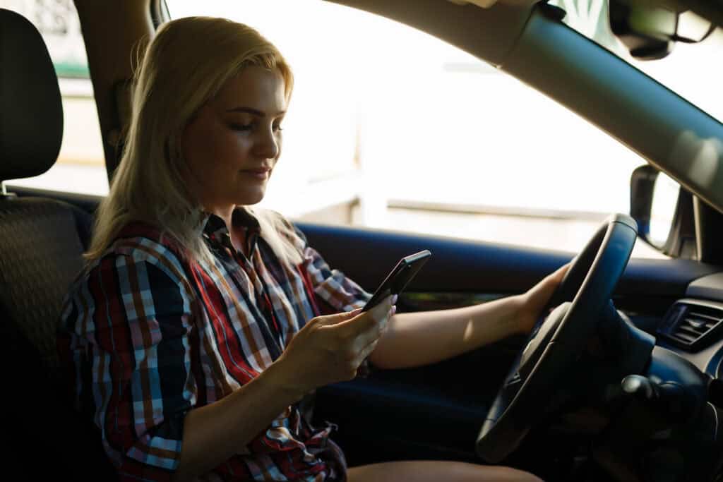 Young woman driving her car