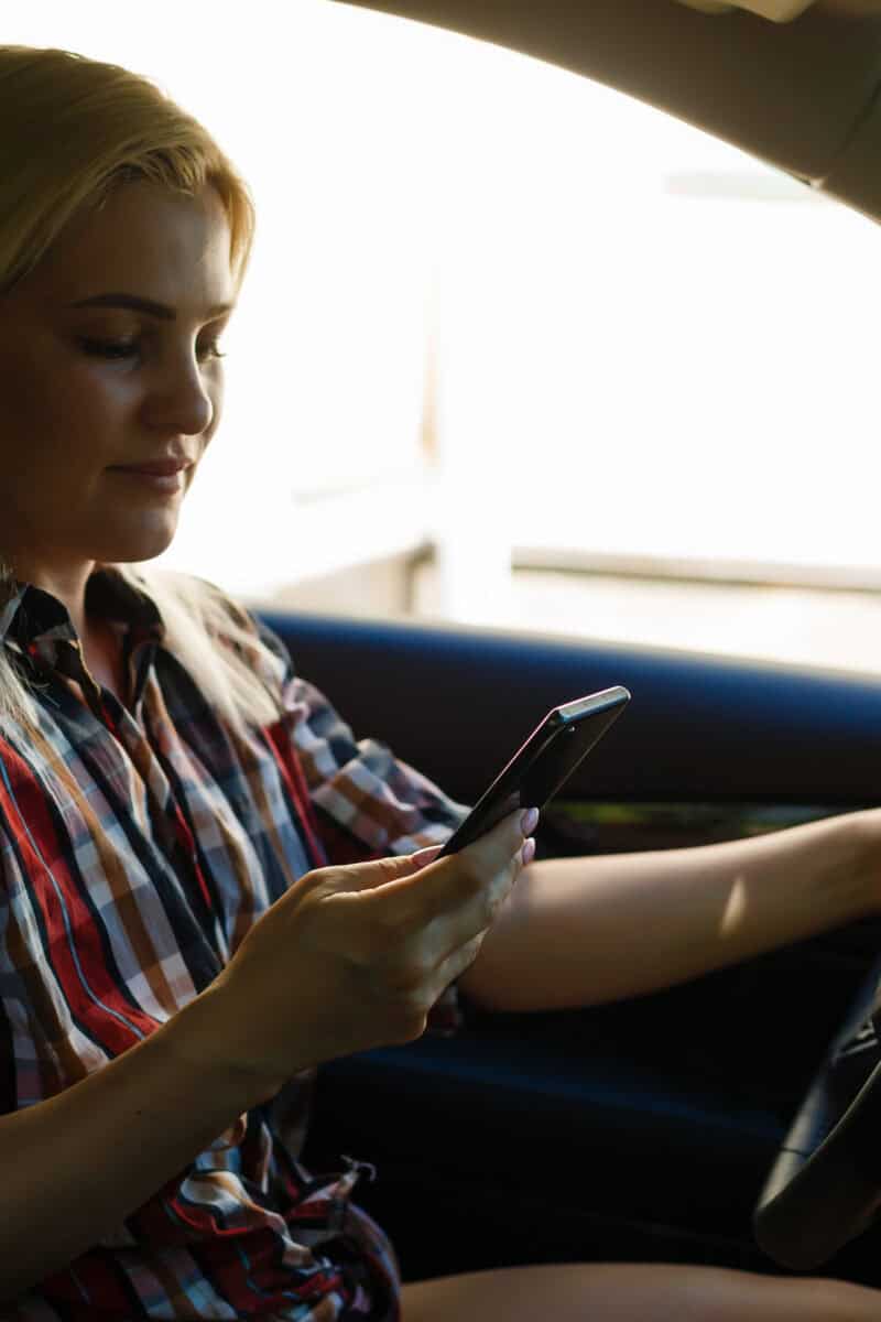 Young woman driving her car