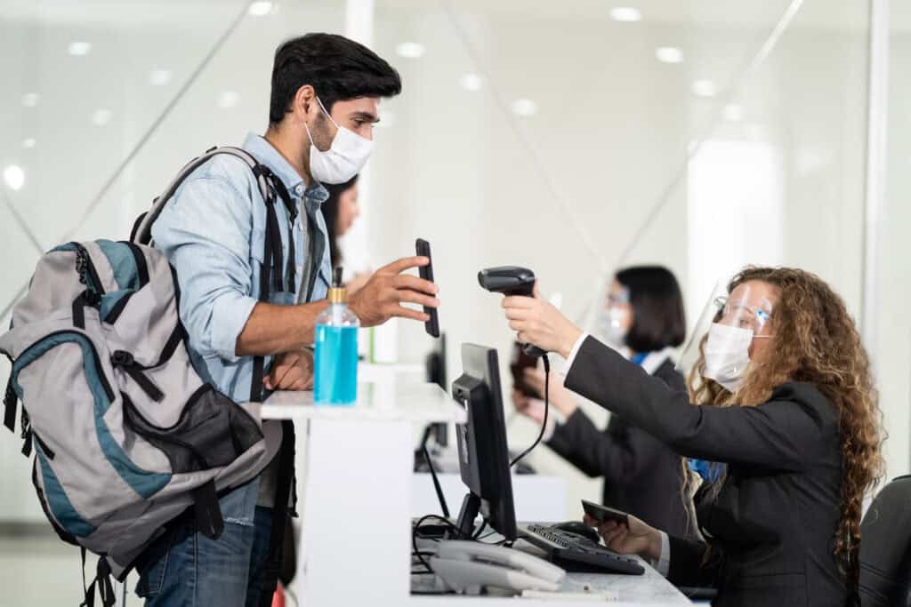 biometric security camera airport checkpoint travelers scan at kiosk