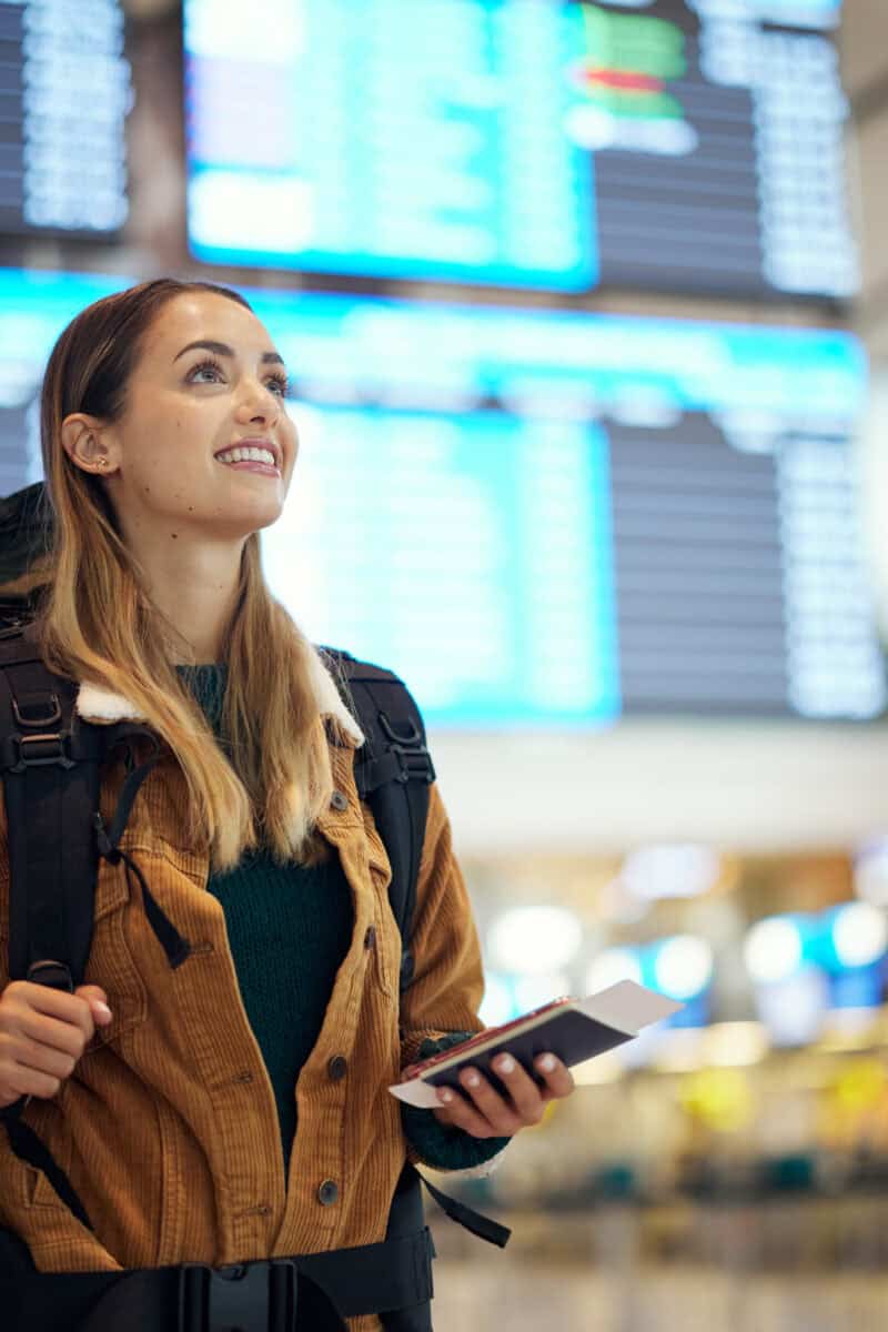 Travel, airport and excited woman with passport.