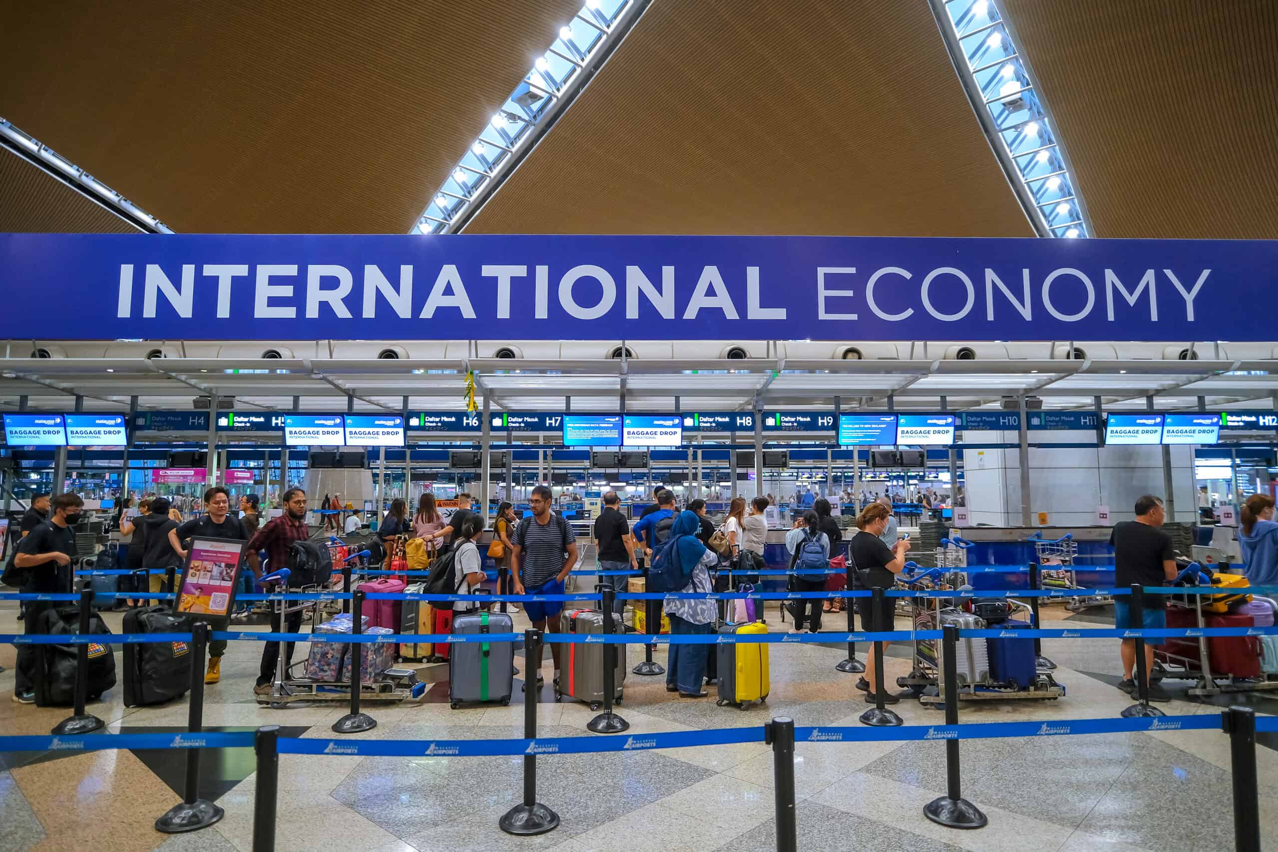 busy international airport terminal crowd check in counters