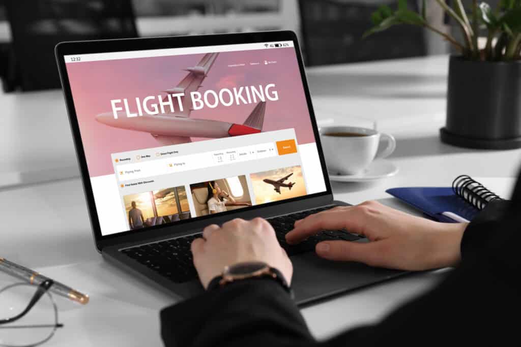 traveler booking flight online laptop close up