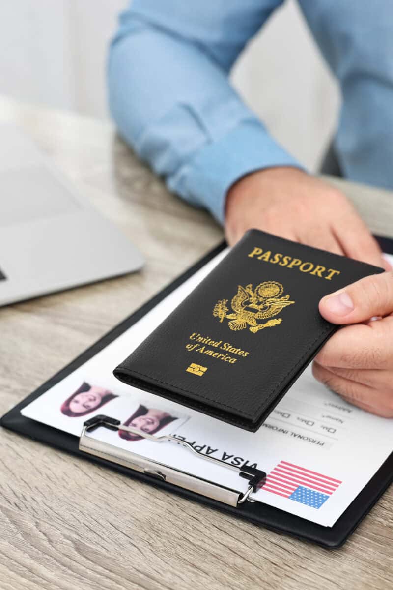 traveler checking visa documents airport