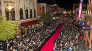 Large crowd gathering for a red carpet event at a film festival