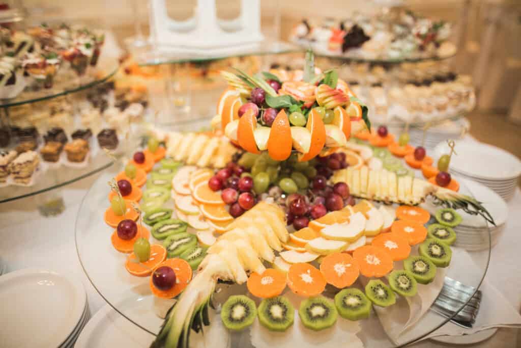 Cut fruit in shallow bowls: “hotel breakfast buffet cut fruit display bowl melon berries”