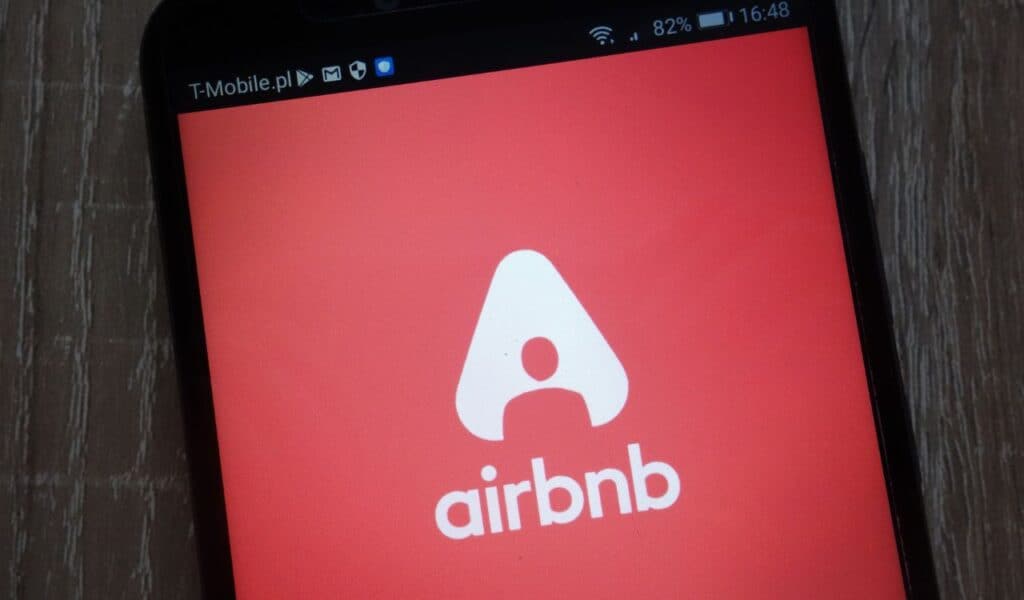 Airbnb logo displayed on a modern smartphone