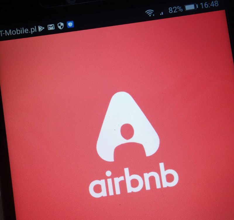 Airbnb logo displayed on a modern smartphone